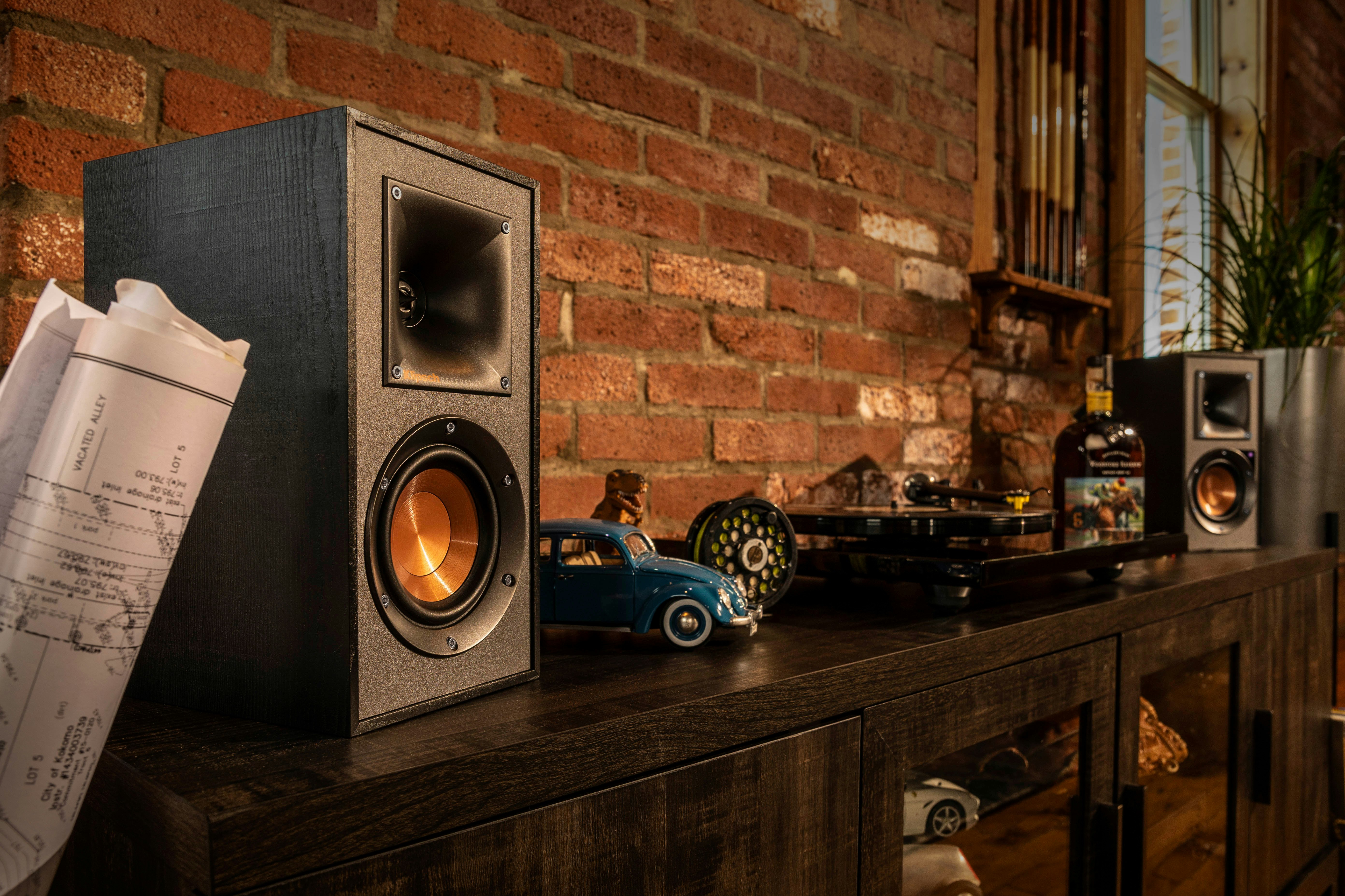 Klipsch Reference Powered Speakers on a wooden cabinet